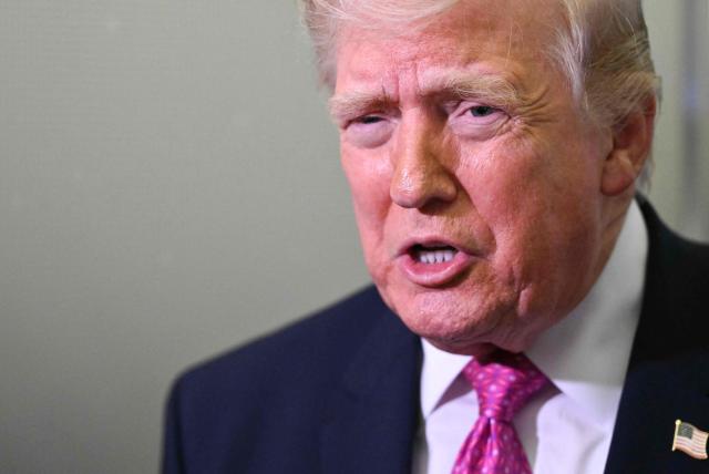 US President Donald Trump speaks to reporters aboard Air Force One en route to Joint Base Andrews, Maryland, on March 29, 2026. US President Donald Trump is returning to White House after spending the weekend at his Mar-A-Lago residence. (Photo by Mandel NGAN / AFP)
