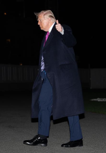 US President Donald Trump gives a thumb's up as he walks on the South Lawn upon returning to the White House in Washington, DC, on March 29, 2026. Trump is returning from a weekend at his Mar-a-Lago resort. (Photo by Ken CEDENO / AFP)