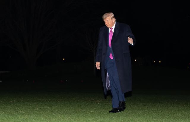 US President Donald Trump walks on the South Lawn upon returning to the White House in Washington, DC, on March 29, 2026. Trump is returning from a weekend at his Mar-a-Lago resort. (Photo by Ken CEDENO / AFP)
