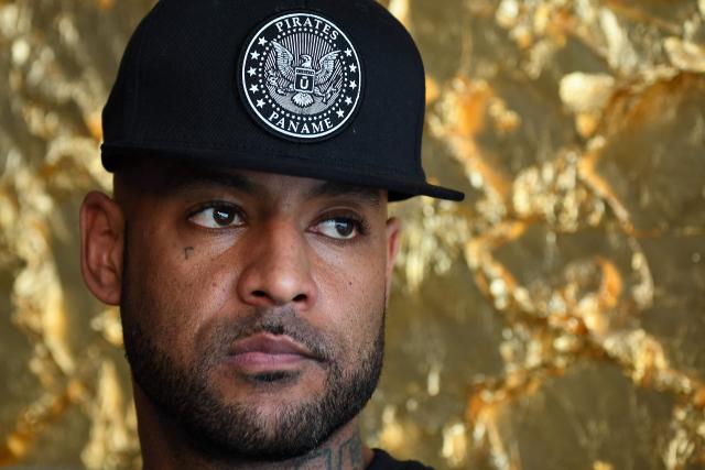 (FILES) French rap artist Booba poses at the Stade de lAmitié Sino-gabonaise Stadium in Libreville on January 13, 2017 on the eve of the opening game of the 2017 Africa Cup of Nations football tournament Gabon vs Guinea Bissau. The trial of rapper Elie Yaffa, known as Booba, on charges of racist insults and cyberharassment against a journalist and an essayist opens at the Paris criminal court on April 1, 2026. The case concerns messages posted in January 2024 targeting journalist Linh-Lan Dao and essayist Tristan Mendes France. (Photo by GABRIEL BOUYS / AFP)