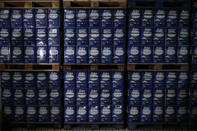 This photograph taken on February 19, 2026 shows feta in tin boxes in a cheese factory in Thessaloniki. From August 2024 to early March 2026, more than 480,000 sheep and goats have been slaughtered because of the pandemic, mainly in central and northern Greece. Producers say the resulting fall in the livestock population and milk production is threatening feta, one of Greece's premier exports. (Photo by Sakis Mitrolidis / AFP)