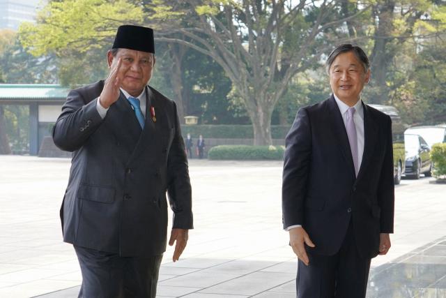 Indonesia's President Prabowo Subianto (L) is greeted by Japan's Emperor Naruhito at the Imperial Palace in Tokyo on March 30, 2026. (Photo by Kazuhiro NOGI / AFP)