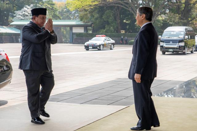 Indonesia's President Prabowo Subianto (L) is greeted by Japan's Emperor Naruhito at the Imperial Palace in Tokyo on March 30, 2026. (Photo by Kazuhiro NOGI / AFP)