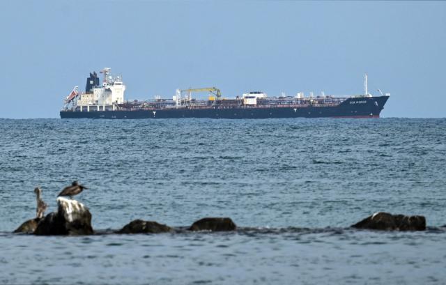 The Hong Kong-flagged crude oil tanker Sea Horse remains at anchor off the coast of Puerto Cabello, Venezuela, on March 29, 2026. The Sea Horse, which was reportedly carrying Russian diesel to Cuba, rerouted to Venezuela earlier in the week. (Photo by Maryorin Mendez / AFP)