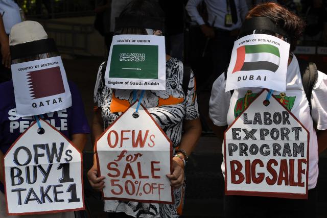 Activists demonstrate in front of the Department of Migrant Workers (DMW) headquarters in Manila on March 30, 2026, as they call for the protection of Philippine migrant workers in the Middle East after US-Israeli strikes on Iran last month triggered a war in the region. (Photo by Ted ALJIBE / AFP)