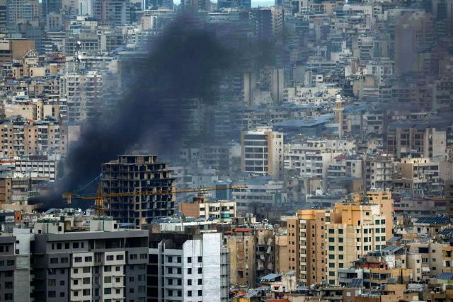 Smoke rises from the site of an Israeli airstrike that targeted an area in Beirut’s southern suburbs on March 30, 2026. A strike hit Beirut's southern suburbs on March 30 after Israel issued a warning for people in the Hezbollah stronghold to leave. The strike is the first since March 27 in the area, which is now largely deserted since Israel began frequent attacks against Hezbollah earlier in the month. (Photo by ibrahim AMRO / AFP) / 