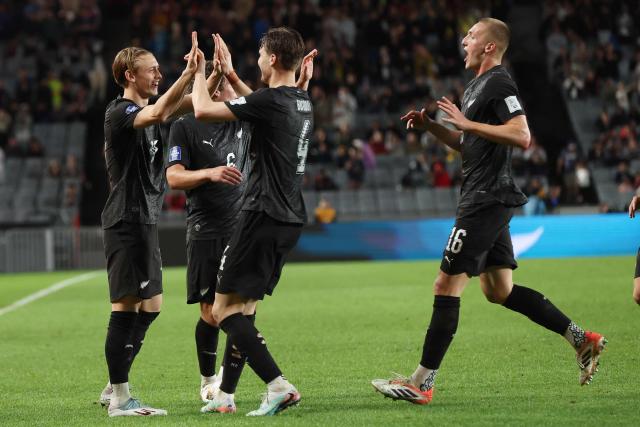 New Zealand's Ben Waine celebrates his goal with teammates during the international friendly football match between New Zealand and Chile at Eden Park in Auckland on March 30, 2026. (Photo by Michael Bradley / AFP)