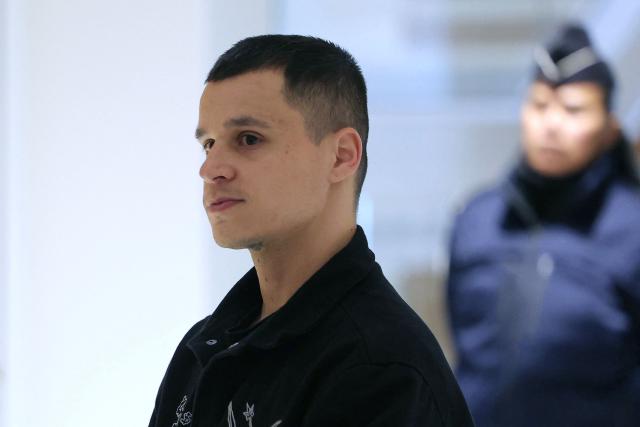 Defendant Donovan Lefranc arrives for the opening of the so-called Athanor trial, in which 22 people are facing a wide range of charges, including murder, centred on the Athanor Masonic lodge accused of running hit squads, at the Assize Court in the Tribunal Judiciaire courthouse in Paris, on March 30, 2026. The 22 defendants are accused of murder, attempted murder, aggravated assault and criminal conspiracy on behalf of a mafia network inside the Athanor Masonic Lodge in the Paris suburb of Puteaux. At least four freemasons from the 20 or so members of the lodge are in the dock. Other defendants include four officers from France's DGSE foreign intelligence service, three police officers, six business executives, a security guard, a doctor and an engineer. (Photo by Thomas SAMSON / AFP)
