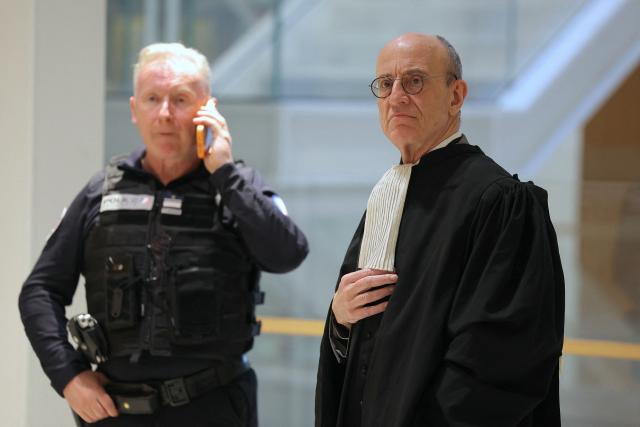 Marc Pantaloni (R), lawyer of defendant Daniel Beaulieu, looks on during a break at the opening of the so-called Athanor trial, in which 22 people are facing a wide range of charges, including murder, centred on the Athanor Masonic lodge accused of running hit squads, at the Assize Court in the Tribunal Judiciaire courthouse in Paris, on March 30, 2026. The 22 defendants are accused of murder, attempted murder, aggravated assault and criminal conspiracy on behalf of a mafia network inside the Athanor Masonic Lodge in the Paris suburb of Puteaux. At least four freemasons from the 20 or so members of the lodge are in the dock. Other defendants include four officers from France's DGSE foreign intelligence service, three police officers, six business executives, a security guard, a doctor and an engineer. (Photo by Thomas SAMSON / AFP)