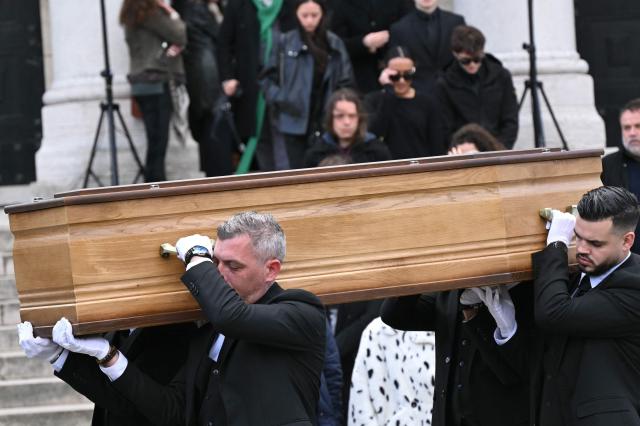 Pall-bearers carry the coffin of French actress and director Isabelle Mergault during her funeral at the Pere-Lachaise cemetery in Paris on March 30, 2026. Mergault, whose career spanned more than four decades, died on March 20, 2026, at the age of 67. (Photo by Bertrand GUAY / AFP)