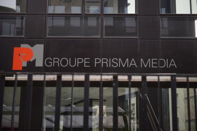 (FILES) A photograph shows the building of Prisma Media Group, taken on March 17, 2014 in Gennevilliers, a suburb near Paris. Prisma Group, the leading magazine publisher in France, announced to staff representatives on March 30, 2026 a plan to cut 261 jobs, representing 40% of its workforce, according to the CGT union. (Photo by Martin BUREAU / AFP)