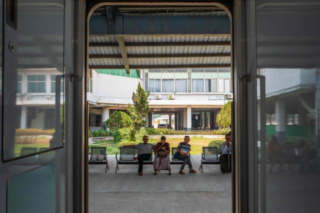 Passengers wait for trains at a station platform in Naypyidaw on March 29, 2026. (Photo by ANTHONY WALLACE / AFP)