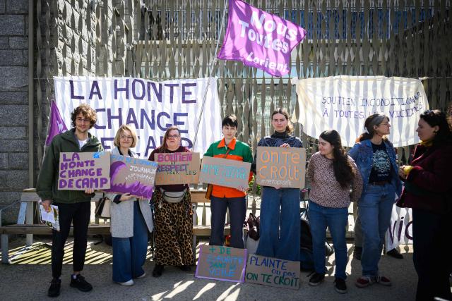 Activists gather to support victims of sexist violence in front of the courthouse where the trial of French skipper Kevin Escoffier on charges of sexual assault opens in Lorient, western France, on March 30, 2026. (Photo by Loic VENANCE / AFP)