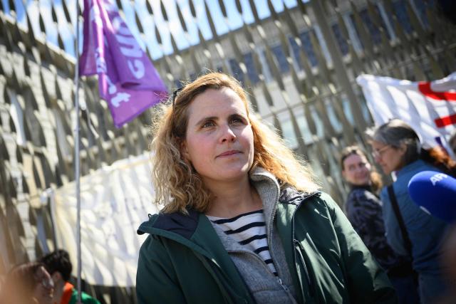 French skipper Clarisse Cremer talks to journalists in front of the courthouse where the trial of French skipper Kevin Escoffier on charges of sexual assault opens in Lorient, western France, on March 30, 2026. (Photo by Loic VENANCE / AFP)