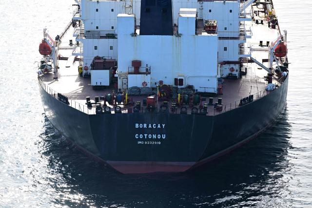 (FILES) This aerial picture taken on October 1, 2025 off the coast of the western France port of Saint-Nazaire shows the tanker Boracay from Russia's so-called "shadow fleet" suspected of being involved in drone flights over Denmark which sailed off the Danish coast between September 22 and 25. The Chinese captain of the Boracay, a tanker from the Russian shadow fleet that was seized in September by the French navy off the coast of Brittany, was sentenced on March 30, 2026 to one year in prison by the Brest criminal court for "failing to comply with orders."
Chen Zhangjie, 39, who was not present when the judgment was delivered, was also fined 150,000 euros. The court issued an arrest warrant against him.
Named the Pushpa or Boracay, the Benin-flagged vessel, which is blacklisted by the European Union for being part of Russia's sanction-busting "shadow fleet", has been immobilised for several days off the French coast. (Photo by Damien MEYER / AFP)