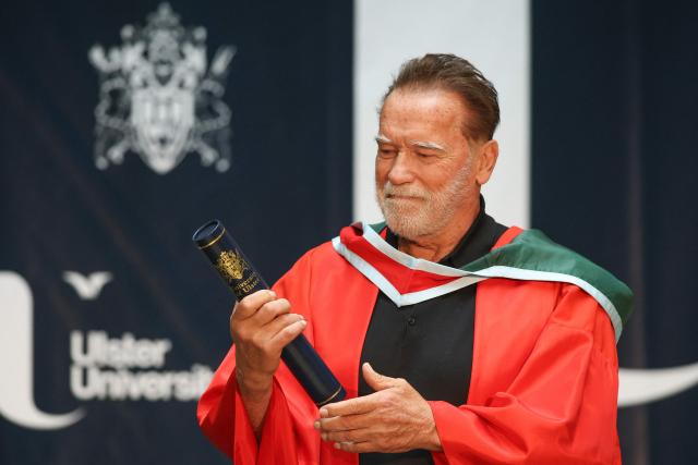 Hollywood actor and former California state governor, Arnold Schwarzenegger, attends a ceremony to receive an honorary doctorate from Ulster University in Belfast, Northern Ireland, on March 30, 2026. (Photo by Paul Faith / AFP)