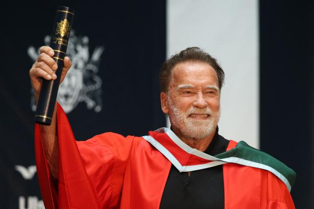 Hollywood actor and former California state governor, Arnold Schwarzenegger, attends a ceremony to receive an honorary doctorate from Ulster University in Belfast, Northern Ireland, on March 30, 2026. (Photo by Paul Faith / AFP)
