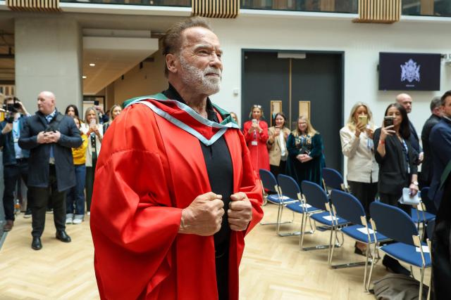 Hollywood actor and former California state governor, Arnold Schwarzenegger, arrives at a ceremony to receive an honorary doctorate from Ulster University in Belfast, Northern Ireland, on March 30, 2026. (Photo by Paul Faith / AFP)
