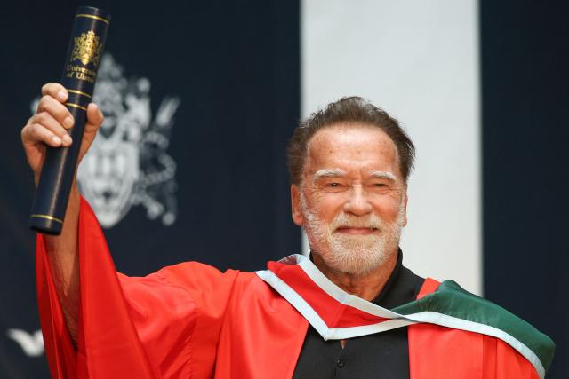 Hollywood actor and former California state governor, Arnold Schwarzenegger, attends a ceremony to receive an honorary doctorate from Ulster University in Belfast, Northern Ireland, on March 30, 2026. (Photo by Paul Faith / AFP)