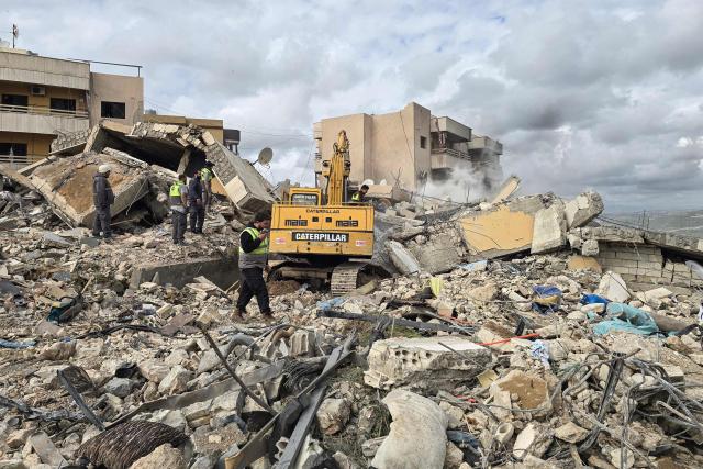First responders work on the rubble of a building targeted by an Israeli airstrike in the southern Lebanese village of Hanouiyeh, east of Tyre, on March 30, 2026. Israel renewed its bombardment of Beirut's southern suburbs on March 30 while continuing air strikes on Lebanon's south, one of which targeted an army checkpoint and killed a soldier. Lebanon was pulled into the Middle East conflict when Tehran-backed armed group Hezbollah fired rockets at Israel on March 2 in revenge for the killing of Iran's supreme leader, the opening salvo in the US-Israeli war against the Islamic republic. (Photo by KAWNAT HAJU / AFP)