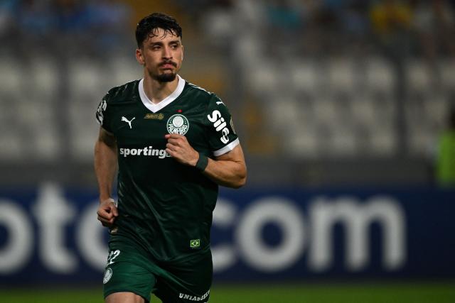 (FILES) Palmeiras' Uruguayan defender #22 Joaquin Piquerez celebrates after scoring a penalty during the Copa Libertadores group stage first round football match between Peru's Sporting Cristal and Brazil's Palmeiras at the Nacional stadium in Lima, on April 3, 2025. Piquerez has suffered a ligament injury to his right ankle and will require surgery, his club, Palmeiras, announced on March 30, 2026, meaning he could miss the World Cup. (Photo by ERNESTO BENAVIDES / AFP)