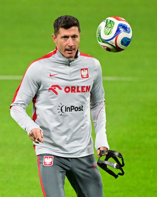 Poland's forward #09 Robert Lewandowski plays the ball during a training session of Poland's national football team on the eve of the play-off FIFA World Cup 2026 qualification final football match Sweden vs Poland, in Stockholm, Sweden on March 30, 2026. (Photo by Jonas EKSTROMER / TT News Agency / AFP) / Sweden OUT