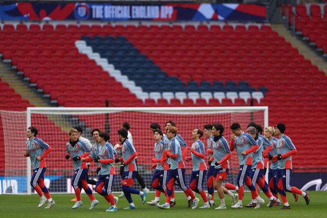 Japan's players take part in a team training session at Wembley Stadium, in London, on March 30, 2026, on the eve of their international friendly football match against England. (Photo by Adrian Dennis / AFP)