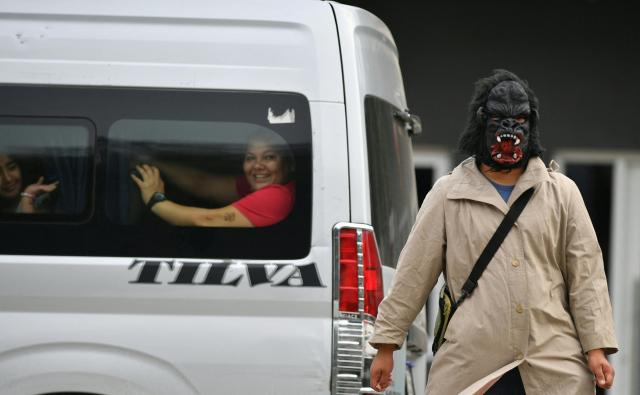 Fancy-dressed parishioners walk through the streets asking for money as part of the Holy Week folk tradition, in Santa Barbara, about 200 kilometers northwest of Tegucigalpa, on March 30, 2026. (Photo by Orlando SIERRA / AFP)