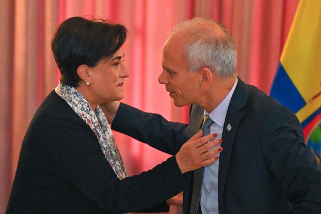 Ecuador’s Foreign Minister Gabriela Sommerfeld (L)greets Israel’s Ambassador to Ecuador, Tzach Sarid, during the signing of bilateral agreements in the areas of culture and sports at the Foreign Ministry in Quito on March 30, 2026. (Photo by Rodrigo BUENDIA / AFP)