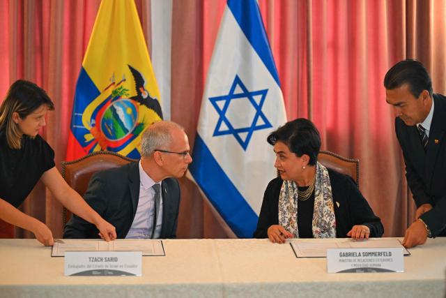 Ecuador’s Foreign Minister Gabriela Sommerfeld (R) speaks with Israel’s Ambassador to Ecuador, Tzach Sarid, during the signing of bilateral agreements in the areas of culture and sports at the Foreign Ministry in Quito on March 30, 2026. (Photo by Rodrigo BUENDIA / AFP)
