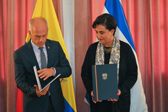 Ecuador’s Foreign Minister Gabriela Sommerfeld (R) and Israel’s Ambassador to Ecuador, Tzach Sarid, attend the signing of bilateral agreements in the areas of culture and sports at the Foreign Ministry in Quito on March 30, 2026. (Photo by Rodrigo BUENDIA / AFP)