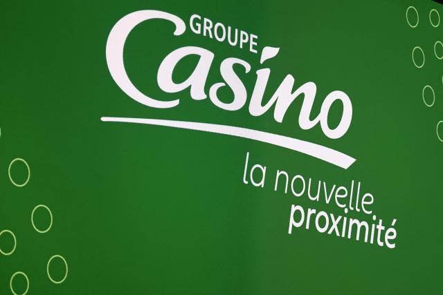 (FILES) The logo of Groupe Casino is seen during the group's annual general meeting on April 30, 2025 in Puteaux, near Paris. Casino deepened its net loss to 402 million euros in 2025, due in part to a major social plan launched in 2024, but the retailer said on March 30, 2026, its profitability improves "significantly" as debt-restructuring negotiations continue. (Photo by Thibaud MORITZ / AFP)