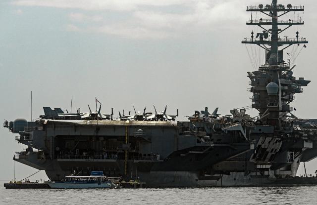 The US Navy aircraft carrier USS Nimitz sails on Panama Bay, in Panama City on March 30, 2026. The ship reached the country alongside the guided-missile destroyer USS Gridley (DDG 101), as part of the multinational maritime cooperation exercises “Mares del Sur 2026.” (Photo by HUGE PERALTA / AFP)
