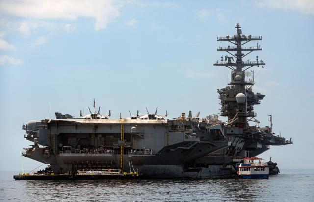 The US Navy aircraft carrier USS Nimitz sails on Panama Bay, in Panama City on March 30, 2026. The ship reached the country alongside the guided-missile destroyer USS Gridley (DDG 101), as part of the multinational maritime cooperation exercises “Mares del Sur 2026.” (Photo by HUGE PERALTA / AFP)