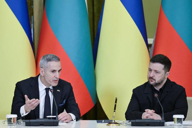 Ukrainian President Volodymyr Zelensky (R) and Bulgarian Prime Minister Andrey Gyurov attend a joint press conference after meeting in Kyiv on March 30, 2026, amid the Russian invasion of Ukraine. (Photo by Genya SAVILOV / AFP)