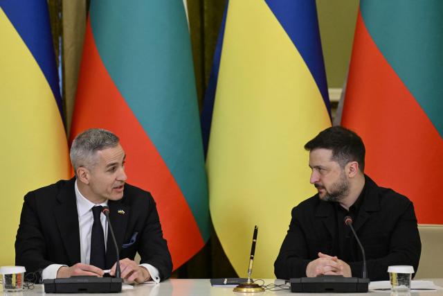 Ukrainian President Volodymyr Zelensky (R) and Bulgarian Prime Minister Andrey Gyurov attend a joint press conference after meeting in Kyiv on March 30, 2026, amid the Russian invasion of Ukraine. (Photo by Genya SAVILOV / AFP)