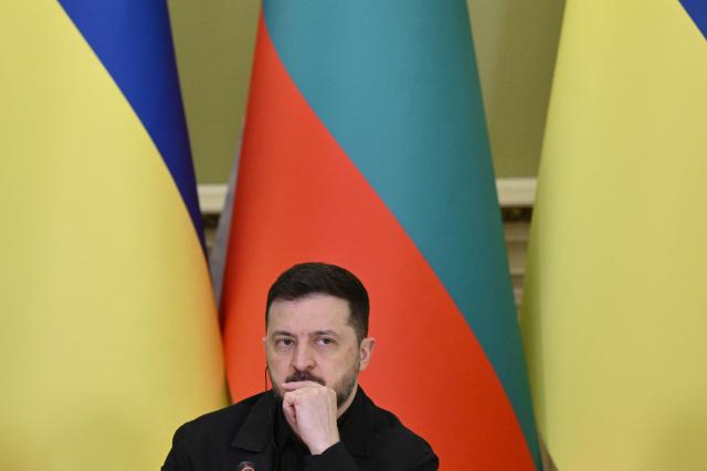 Ukrainian President Volodymyr Zelensky attends a joint press conference with Bulgarian Prime Minister following their meeting in Kyiv on March 30, 2026, amid the Russian invasion of Ukraine. (Photo by Genya SAVILOV / AFP)