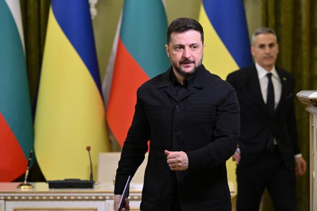 Ukrainian President Volodymyr Zelensky (L) and Bulgarian Prime Minister Andrey Gyurov (R) leave after a joint press conference following their meeting in Kyiv on March 30, 2026, amid the Russian invasion of Ukraine. (Photo by Genya SAVILOV / AFP)