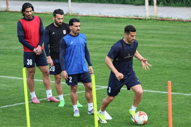 Iran's defender #3 Ehsan Hajsafi (L) and Iran's defender #2 Saleh Hardani take part in a training session in Antalya on March 30, 2026, on the eve of an international friendly football match against Costa Rica. Iran has qualified for the World Cup finals this summer but has asked for its matches to be moved from the US to Mexico after Trump warned that the players' "life and safety" would be at risk if they took part. (Photo by Adem ALTAN / AFP)