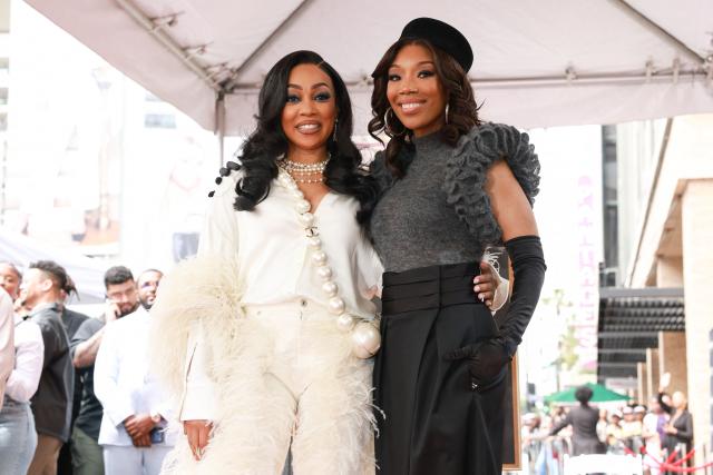 Us singer Monica and US singer and actress Brandy pose with Brandy's newly unveiled Walk of Fame star in Hollywood, California on March 30, 2026. (Photo by Patrick T. Fallon / AFP)