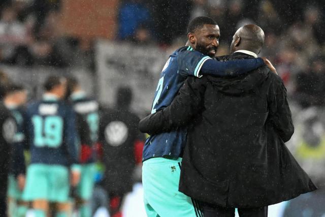 Germany's defender #02 Antonio Ruediger (L) greets Ghana's head coach Otto Addo after the international friendly football match between Germany and Ghana in Stuttgart, southwestern Germany on March 30, 2026. Germany won the match 2-1. (Photo by THOMAS KIENZLE / AFP)