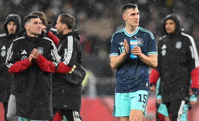 Germany's midfielder #05 Pascal Gross (L) and Germany's defender #15 Nico Schlotterbeck react after the international friendly football match between Germany and Ghana in Stuttgart, southwestern Germany on March 30, 2026. Germany won the match 2-1. (Photo by THOMAS KIENZLE / AFP)