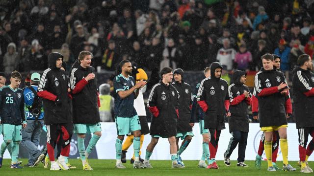 Germany's players greet their fans after winning the international friendly football match between Germany and Ghana in Stuttgart, southwestern Germany on March 30, 2026. Germany won the match 2-1. (Photo by THOMAS KIENZLE / AFP)