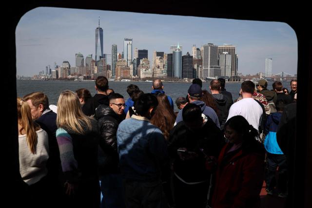 Passengers view the Manhattan skyline from the Staten Island ferry in New York, on March 30, 2026. (Photo by CHARLY TRIBALLEAU / AFP)