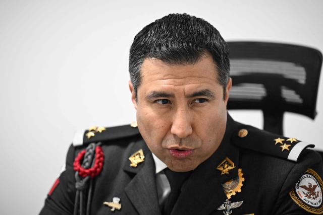 Colonel Rodolfo Blancas, Director of Planning and Supervision for Highways, Airports, Ports, and Borders of Mexico's National Guard, speaks during an interview with AFP at the National Guard headquarters in the Iztapalapa district of Mexico City on March 30, 2022. Cargo transport robbery in Mexico has decreased in recent months, which authorities attribute to measures they have implemented to prevent this crime, such as monitoring and escorting tractor?trailers. (Photo by Yuri CORTEZ / AFP)