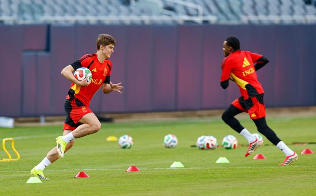 Belgium's forward Charles De Ketelaere (L) runs with the ball during a training session at Soldier Field in Chicago, Illinois on March 30, 2026. Belgium is preparing for tomorrow's international friendly match against Mexico, in advance of the 2026 World Cup. (Photo by KAMIL KRZACZYNSKI / AFP)
