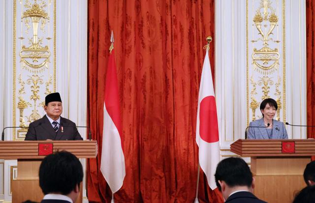 Indonesia's President Prabowo Subianto (L) and Japan's Prime Minister Sanae Takaichi (R) give press statements after their meeting at the Akasaka guesthouse in Tokyo on March 31, 2026. (Photo by YOSHIKAZU TSUNO / POOL / AFP)