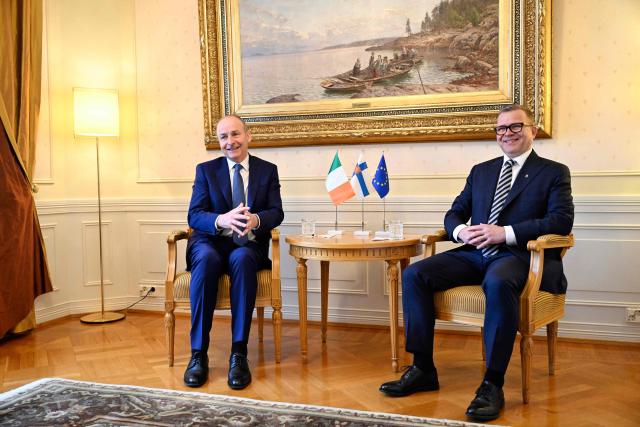 Finnish Prime Minister Petteri Orpo (R) welcomes Irish Prime Minister Micheal Martin (R) ahead of their meeting at the Prime Minister's official residence Kesaranta in Helsinki on March 31, 2026. (Photo by Emmi Korhonen / Lehtikuva / AFP) / Finland OUT