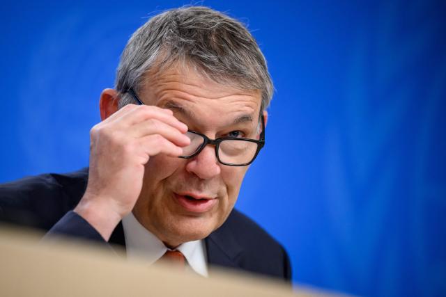 UN agency for Palestinian refugees, UNRWA, outgoing Commissioner-General Philippe Lazzarini adjusts his glasses during his end of mandate press briefing at the United Nations offices in Geneva on March 31, 2026. (Photo by Fabrice COFFRINI / AFP)