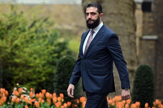 Syria's President Ahmed al-Sharaa arrives ahead of a meeting with Britain's Prime Minister Keir Starmer at 10 Downing Street in central London on March 31, 2026. (Photo by JUSTIN TALLIS / POOL / AFP)